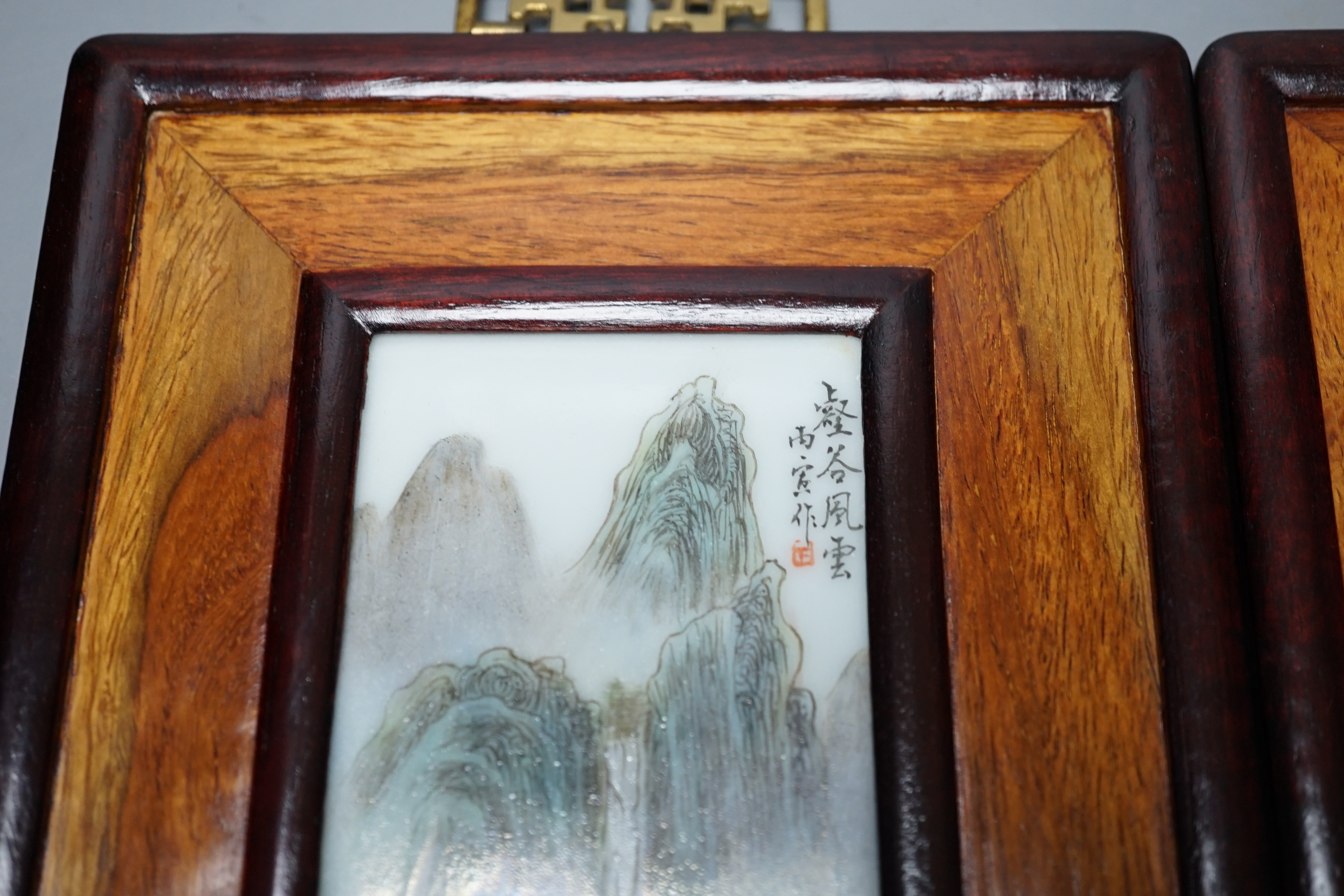 A pair of Chinese framed porcelain plaques 25x15cm including frame